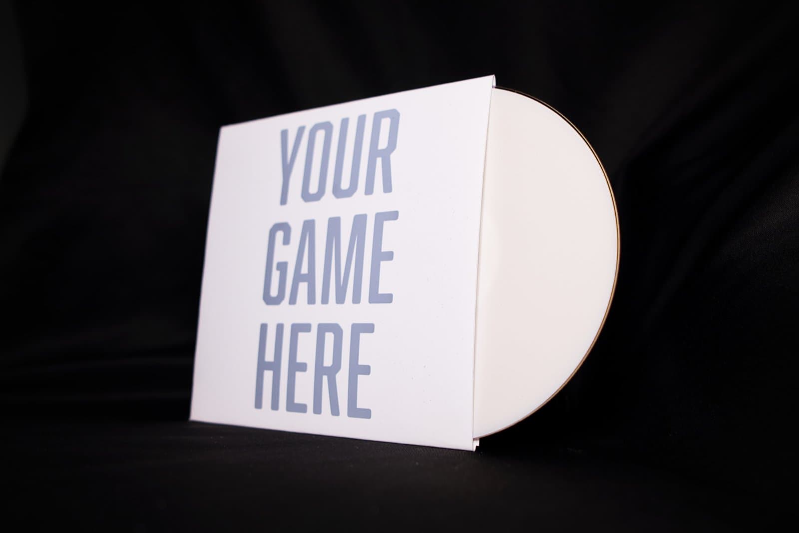 A white disc sleeve printed with the words YOUR GAME HERE, photographed on a black backdrop