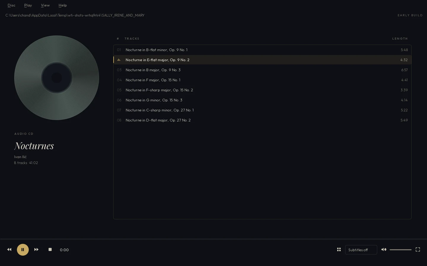 Goldwing Media Player with an audio CD in: the disc spinning at left, the eight tracks listed with names and lengths at right, the second track playing.