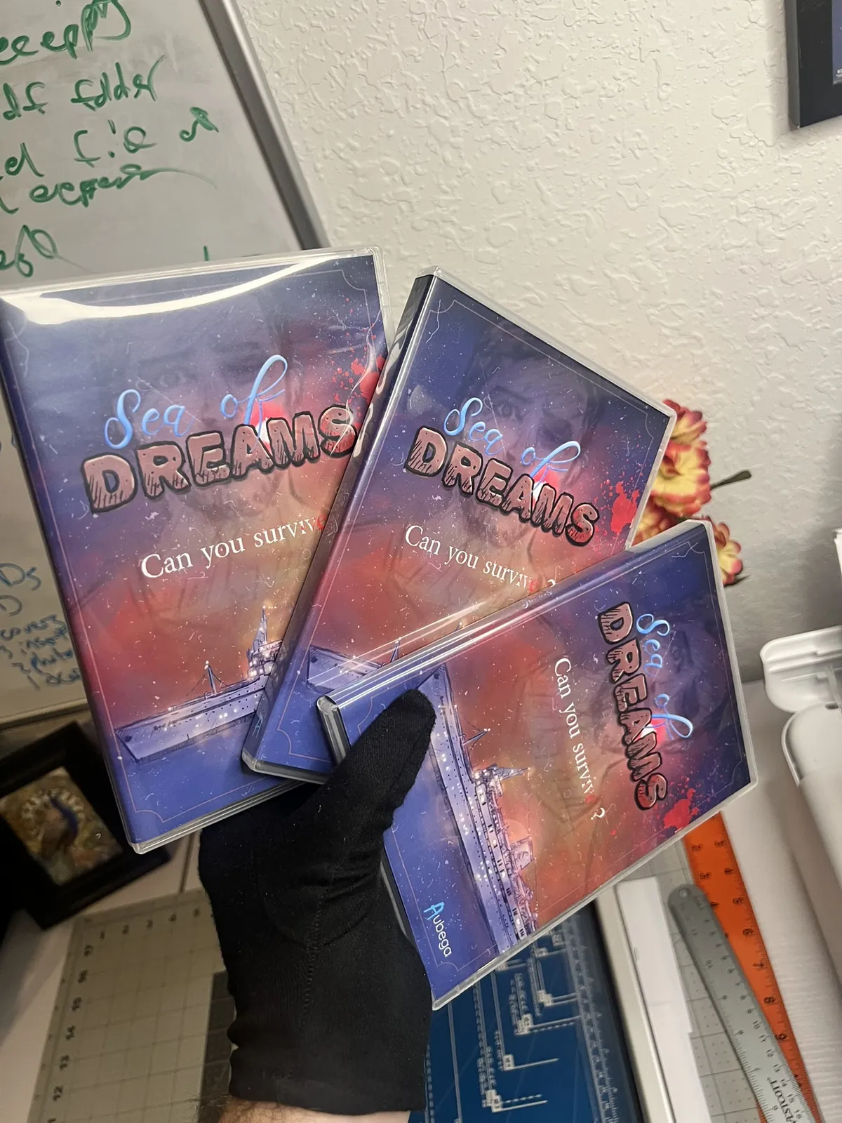 Finished Sea of Dreams cases held in two hands