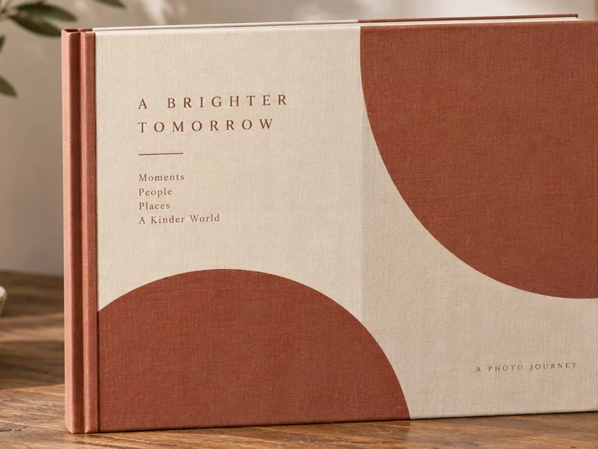 A landscape hardcover book with a cream and terracotta cover.